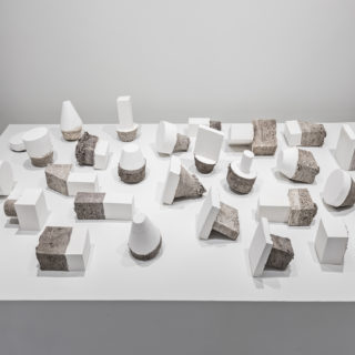 Deborah Wang, Earth Plugs, 2014, white gypsum cement, dimensions variable, from Loose Ends, Critical Distance Centre for Curators 2016. Installation documentation by Toni Hafkenscheid.