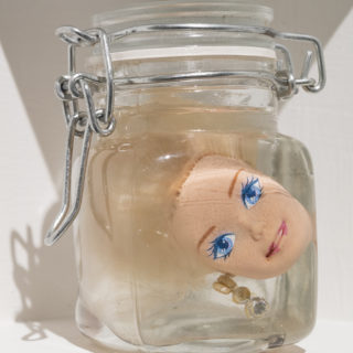 Gabriel Lalonde, Barbies format voyage, (detail), 1995–2004, Barbies, mason jars, oil, 8 x 8 x 5 cm, in The Amoebic Workshop, curated by Astarte Rowe, Critical Distance Centre for Curators, 2016. Installation documentation by Toni Hafkensheid.