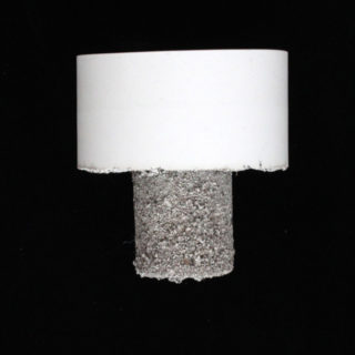 C-04 (large cylinder on small cylinder), from the series Earth Plugs, 2014. White gypsum cement. 5x5x5 inches.