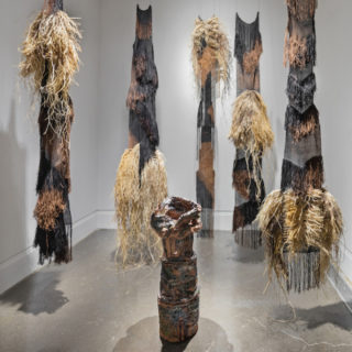 Sung From the Mouth of Cumae, 2015. Handwoven and hand dyed linen, raffia, rust, bleach, earthenware and sound. 10’ x 9’ x 10’.