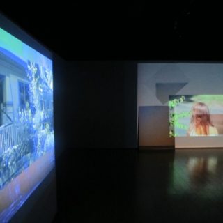 Victoria Fu. Lorem Ipsum I and II (installation), 2013. 16mm film transferred to digital video projection, framed and unframed photographs.