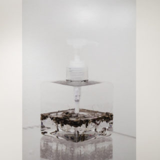 agustine zegers, filthglycerin, 2016/2017, digital print on vinyl of photograph of sculpture (plastic container, organic residue, glycerin, 12 x 12 x 18 cm), 60 x 90 inches, from Fermenting Feminism, Critical Distance Centre for Curators, 2017. Installation documentation by Toni Hafkenscheid.