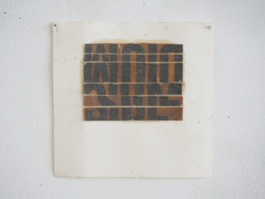 Eric Oglander, cut strips of type from cardboard boxes, beeswax, gauze on watercolor paper, 10"x10"