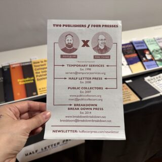 A light skinned hand holds a flyer reading "TWO PUBLISHERS / FOUR PRESSES" from Half Letter Press.