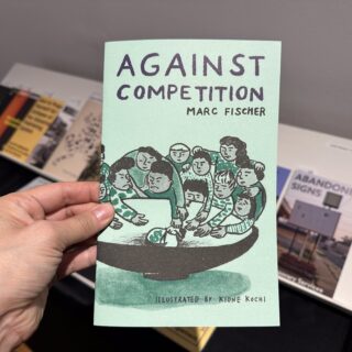 A light skinned hand holds a green zine titled "AGAINST COMPETITION" by Marc Fischer from Half Letter Press.