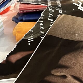 Close-up image of collage materials, including ripped up magazine pages.