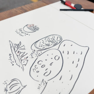Image of drawings on a white sheet of paper.